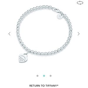 Tiffany’s Bead bracelet with heart charm.